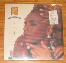 R.J.'s LATEST ARRIVAL - Tangled In Love