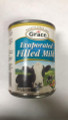 Evaporated Filled Milk in a can with White labeling 