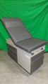 RITTER 104 GYN EXAM TABLE WITH NEW UPHOLSTERY IN CHARCOAL GRAY