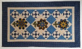 Julie Ploehn-Vigna design - Blue Daisy wool flowers on fabric background