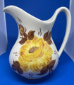 PITCHER WITH HAND PAINTED YELLOW FLOWER HAND MADE BY CASH FAMILY