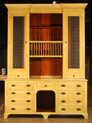 Dinsmore dresser with plate rack and wire screen door panels.