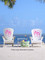 The Conch Key Adirondack Set comes with two chairs with your choice of designs on each chair, along with an accessory table.