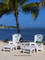 The Summerland Adirondack Chair Set comes with two chairs with your choice of designs on each chair, along with two ottomans and an accessory table.