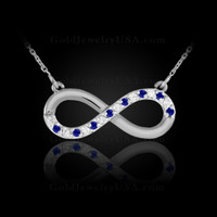 White Gold infinity diamond necklace with blue sapphires.