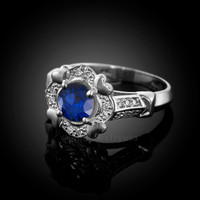 White gold blue sapphire diamond setting engagement ring.