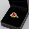 Gold Red Garnet Gemstone Engagement Ring with Diamond Setting.