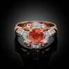 Rose Gold Red Garnet Gemstone Engagement Ring with Diamond Setting.