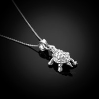 White gold turtle necklace.