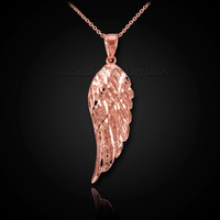 Diamond-cut rose gold angel wing pendant necklace.
Rose Gold wing pendant.