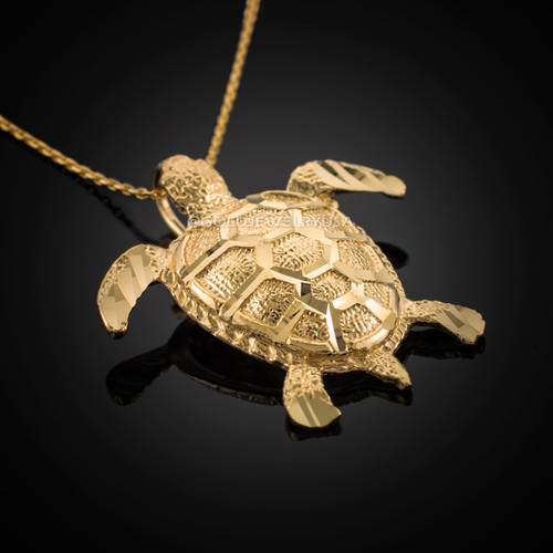 Gold turtle necklace.