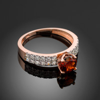 Ladies Diamond pave rose gold Engagement/Anniversary ring with Garnet center stone.