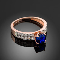 Ladies Diamond pave rose gold Engagement/Anniversary ring with Blue Sapphire center stone.
