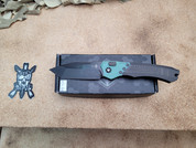 Heretic Wraith Auto Tanto with DLC Coating Carbon Fiber, and Emerald G10.