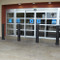 Bollards and Sleeve's 6" Metro Decorative Bollard Covers Protecting a Storefront 