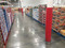 Red Round Column Wrap down an aisle in a big box grocery store