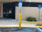 Yellow Heavy Duty Sign Bollard with reflective tape used for handicap accessible parking
