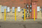 Line of Flat Top Bollard Covers in yellow with red reflective tape