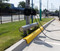 Curb Guard in yellow in front of an EV Charging Station