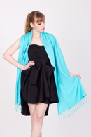 This turquoise pashmina is handmade and versatile. It is made in Nepal from the finest cashmere and silk available. 