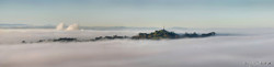 Mist over One Tree Hill photographed from Mt. Eden, Auckland, NZ - print for sale.