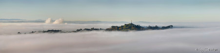 Mist over One Tree Hill photographed from Mt. Eden, Auckland, NZ - print for sale.