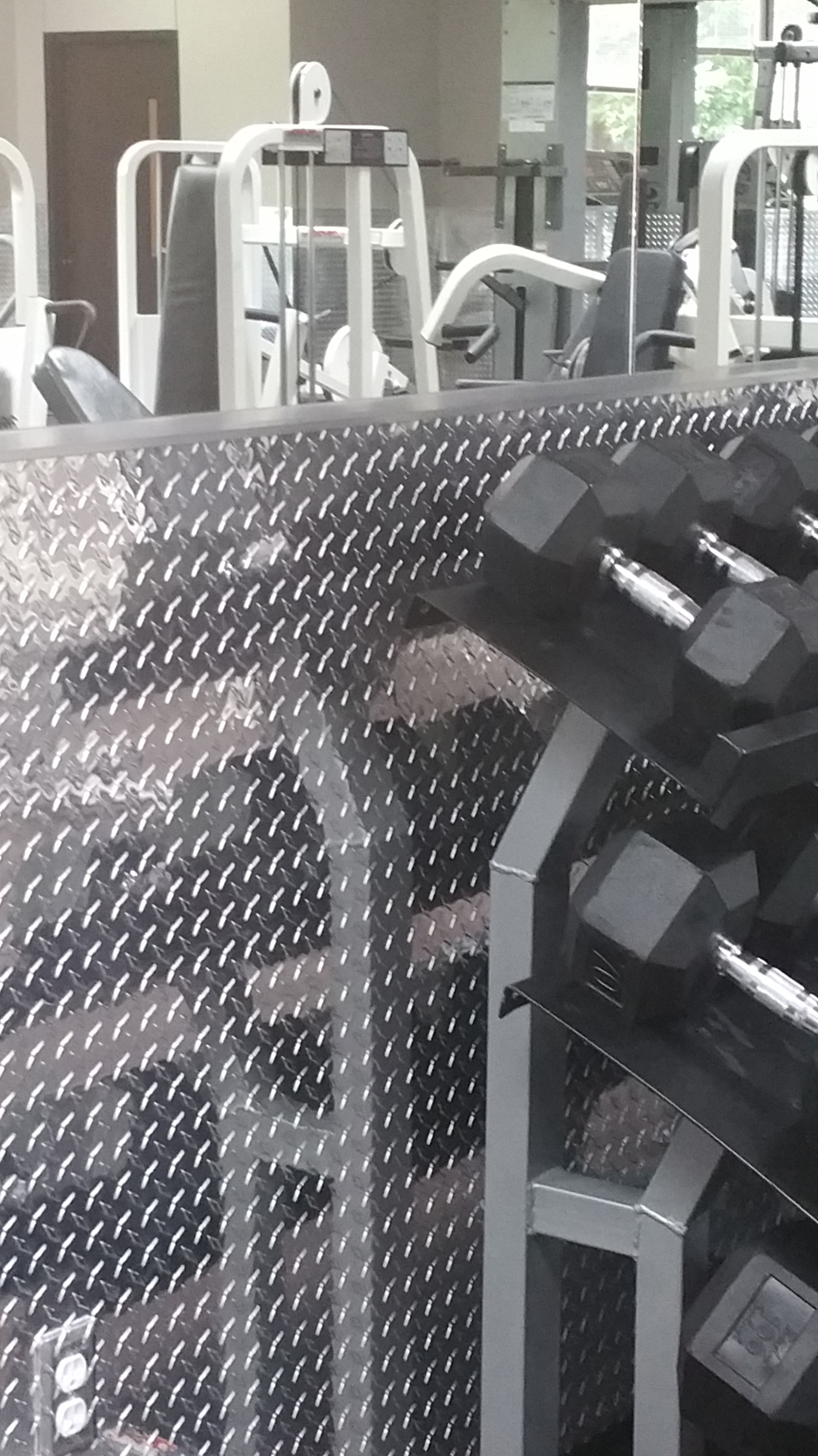 Home gym using silver diamond plate from Cutsmetal