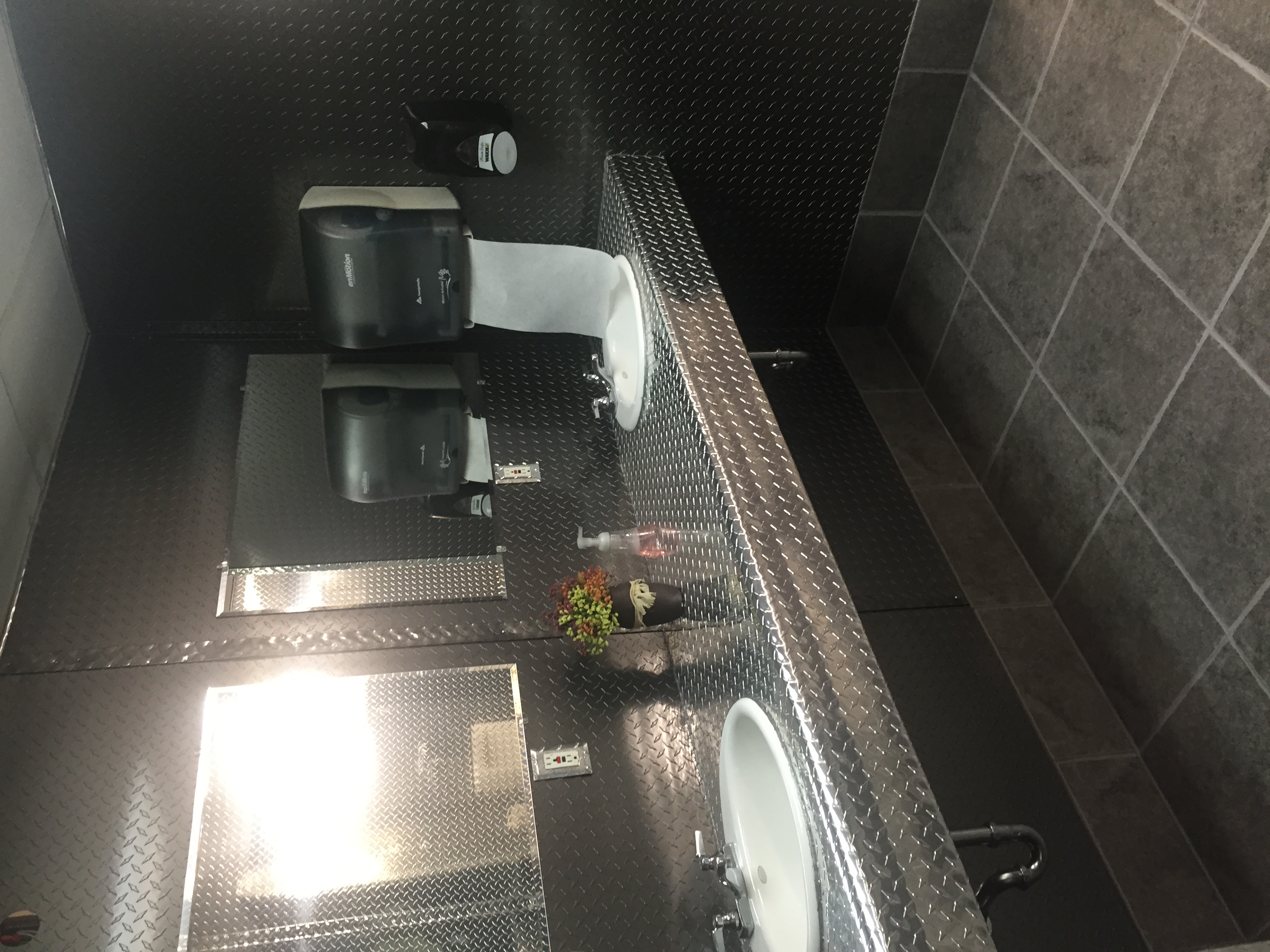 Bathroom remodel using black and silver diamond plate from CutsMetal