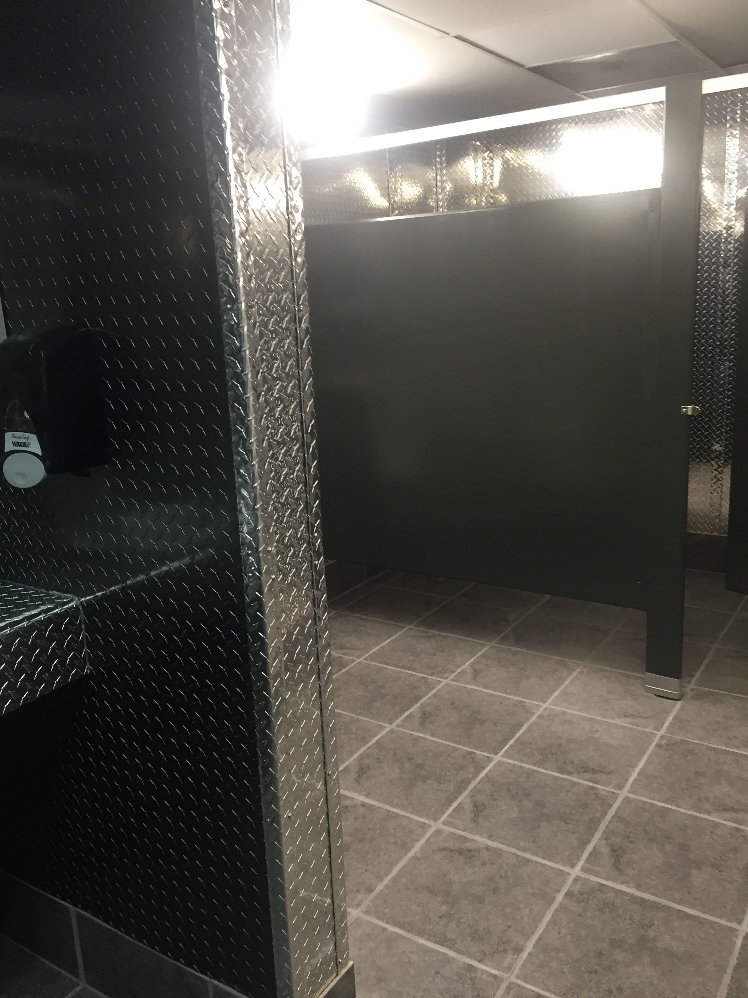 Remodel of bathroom using black and silver diamond plate from CutsMetal