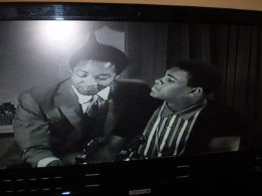 Sam Cooke and Cassius Clay singing "Hey,Hey The Gangs all here"
