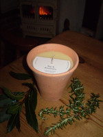 Herb candle in a pretty garden pot