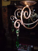 The emerald coloured jewels hanging from the chandelier