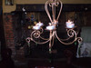 The chandelier works best with Candles but as you can see in the photo t-lites can be used if you make a hole in the base of the T-lite so they fit on the spikes