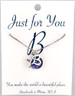 Starfish w/ purple colored button.  18" rhodium plated chain, silver tone.  
You choose your own initial in the box below. 