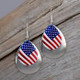 American flag earrings with a silver tone accent piece. 