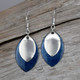 Deep blue with sparkle and a silver accent piece.
Sterling silver ear wire.
