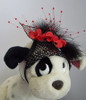 PA. Black mesh with Black/Silver headband, red flowers and black feathers.