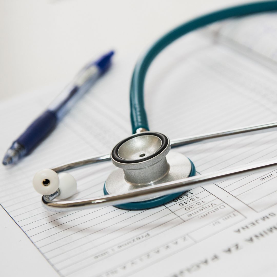 A stethoscope and medical records