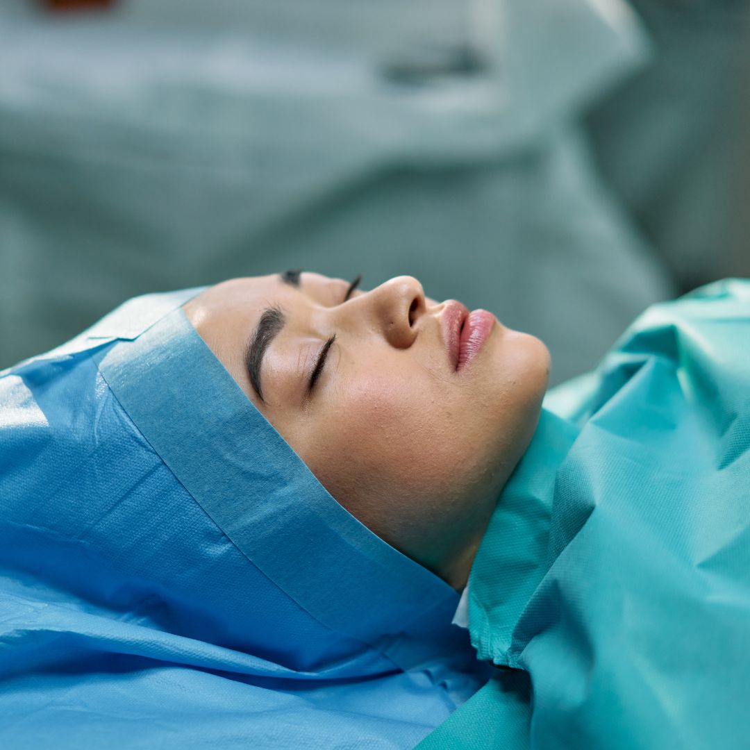 A sedated person in surgery