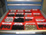 Tool box drawer organized using 6" x 6" x 2" Red Plastic Boxes