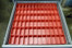 Tool box drawer filled with 72  - 2' x 4" x 2" Red Plastic Bins