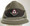 WW2 German Reichsarbeitsdienst (Labor Service) Officers 'Robin Hood' Cap. The quality of the hat is extremely good and it has the distinctive side air-vents, basket-weave aluminum piping with a dark wool brown cap band with a high quality Assmann-made, enameled RAD officers' quality cap badge affixed. The  cloth and enamel badge are as typical for a service cap as opposed to a dress cap made of Trikot with Bullion insignia.