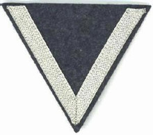 WW2 German Luftwaffe Gefreiter (Lance Corporals) sleeve chevron, one 9mm silver chevron sewn on a inverted LW blue wool triangle. There are slight variations of material backing, colour and embroidery style between these patches. 