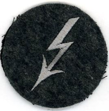 WW2 German Luftwaffe Radio Telephone Operators sleeve insignia. Grey Lightening bolt "Blitz" on a blue-gray wool disc. There are slight variations of material backing, colour and embroidery style between these patches.