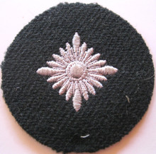 WW2 German Army Panzer or WSS 'Oberschutze' Sleeve Rank Patch, machine embroidered four pointed 'pip' on a BLACK private purchase heavy wool disc with backing. Rare. 