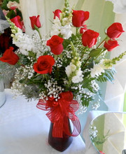 This special bouquet consists of 1 dozen long stem Ecuadorian Red Roses & White Snapdragons in vase a chiffon bow. This beautiful mixture will absolutely make the day brighter for whoever receives it!

***All online orders will be AS CLOSE AS POSSIBLE to the picture shown, minor substitutions for a similar flower might be necessary if the flower is not available or out of season. You can rest assured that each order is made with intention and LOTS of LOVE with only the freshest top quality flowers!