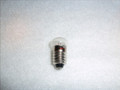 1.1 VOLTS SCREW BASE CLEAR FLAT FACE BULB primarily used for headlights in vintage, battery-powered Lionel toy trains and accessories.