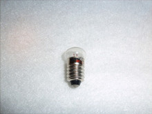 1.1 VOLTS SCREW BASE CLEAR FLAT FACE BULB primarily used for headlights in vintage, battery-powered Lionel toy trains and accessories.