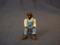PAINTED PEWTER BLACK MAN SITTING ON STOOL IN OVERALLS O GAUGE