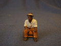 PAINTED PEWTER OLDER BLACK MAN SITTING ON STOOL O GAUGE